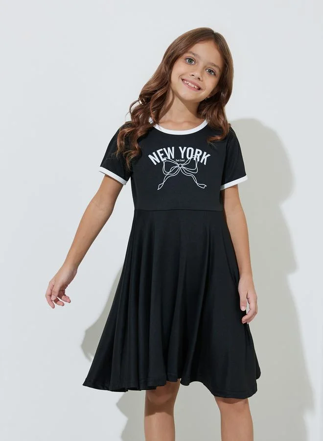 Styli Girls Black Slogan Print Contrast Trims Knee Length T-Shirt Dress