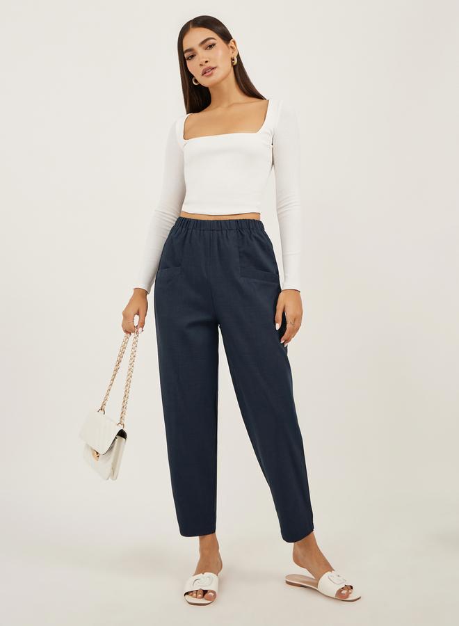 Styli Solid Cropped Tapered Fit Pants with Baggy Pockets - Image 1