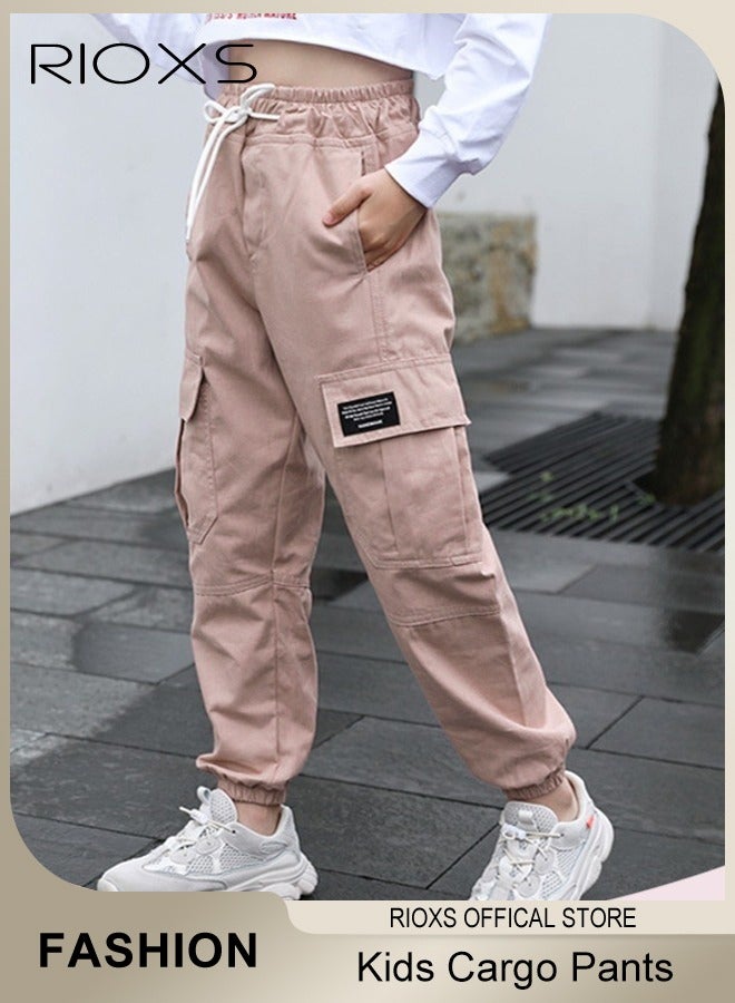 RIOXS Kids Cargo Pants, Skin-friendly Cotton Drawstring Elastic Waist Jogger Pants with Pockets, Lightweight Breathable Quick Dry Cargo Trousers, Multifunctional Fashionable Sports Trousers Sweatpants Joggers for Sschool, Home, Mountain Climbing, Camping, Traveling, Outing and More, Black - Image 1
