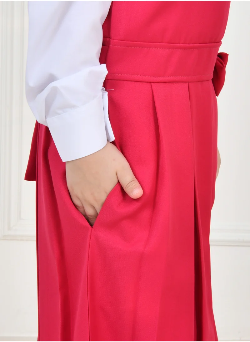 HAWRAA ABAYA Fuchsia apron with wide belt decorated with a bow and pleats with side pockets