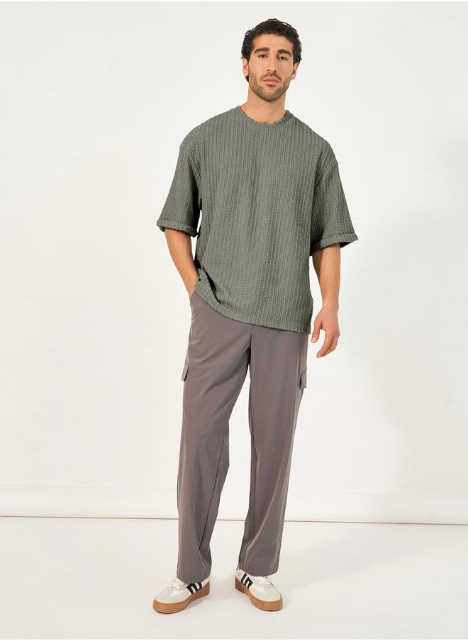 Styli Seersucker Textured Knit Boxy Fitted T-Shirt with Turn-Up Sleeves  - Image 2