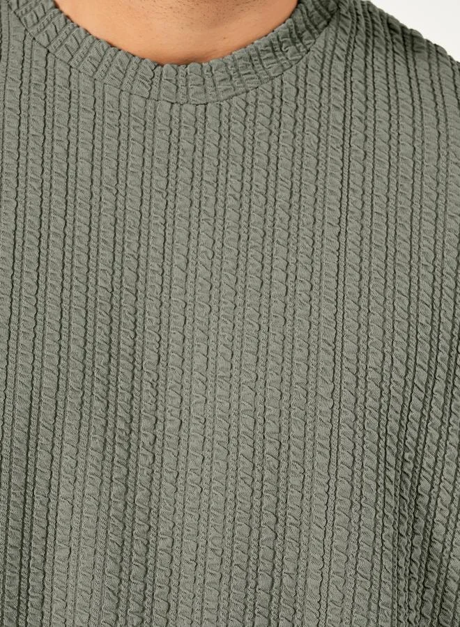 Styli Seersucker Textured Knit Boxy Fitted T-Shirt with Turn-Up Sleeves