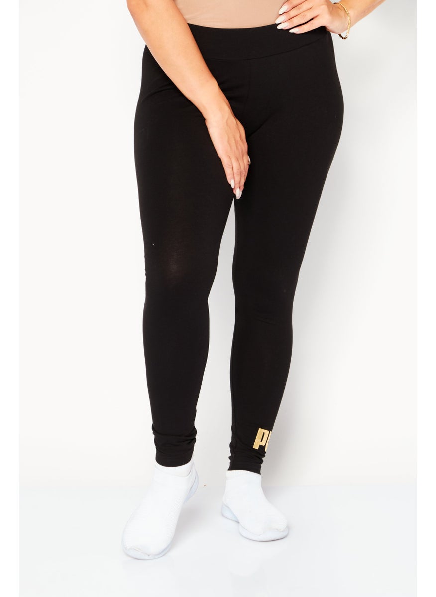 PUMA Women Sportswear Fit Training Tights, Black/Gold  - Image 1