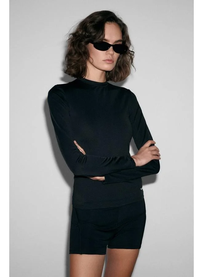 Urban Beat  COREX Women’s Round Neck Printed Detail Slim Fit Long Sleeve Sports Black T-Shirt. for Women | Best Price UAE