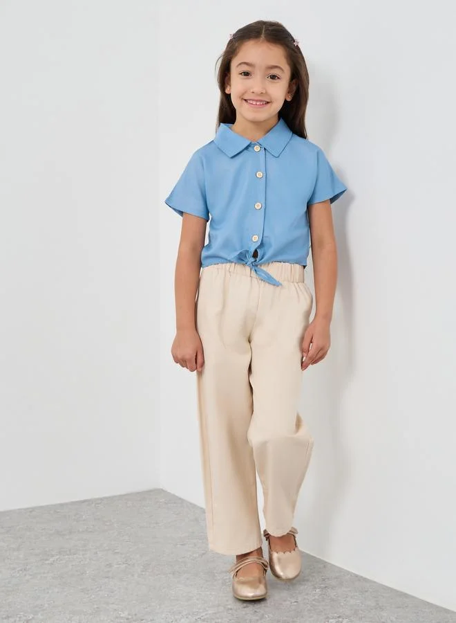 ستايلي قميص بأزرار أمامية بربطة وأكمام قصيرة