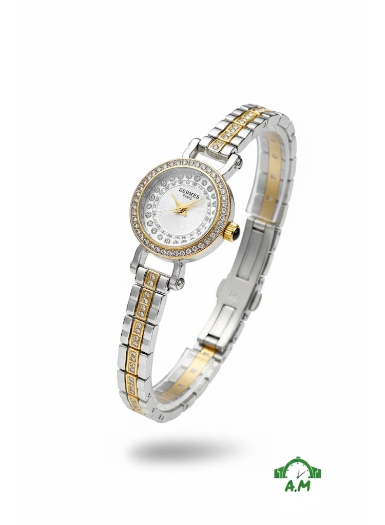 هيرميس ساعة هيرميس باريس النسائية ثنائية اللون من الفضة والذهب تعمل بالكوارتز مع إطار مرصع بالكريستال