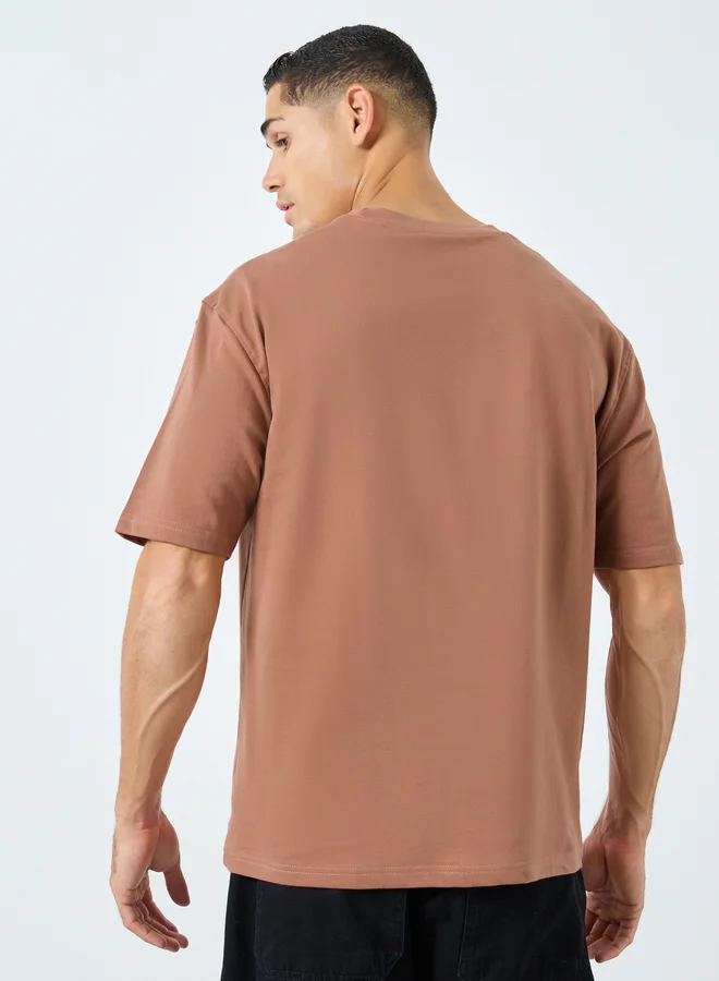 ستايلي Styli Coffee Brown Oversized Embossed Slogan T-Shirt
