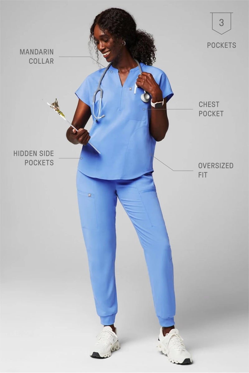 Fabletics Women's Evolve 3-Pocket Scrub Top with an Oversized Fit - MotionTech, 4-Way Stretch, Wrinkle-Resist, Anti-Shrink, L, Ceil Blue - Image 5