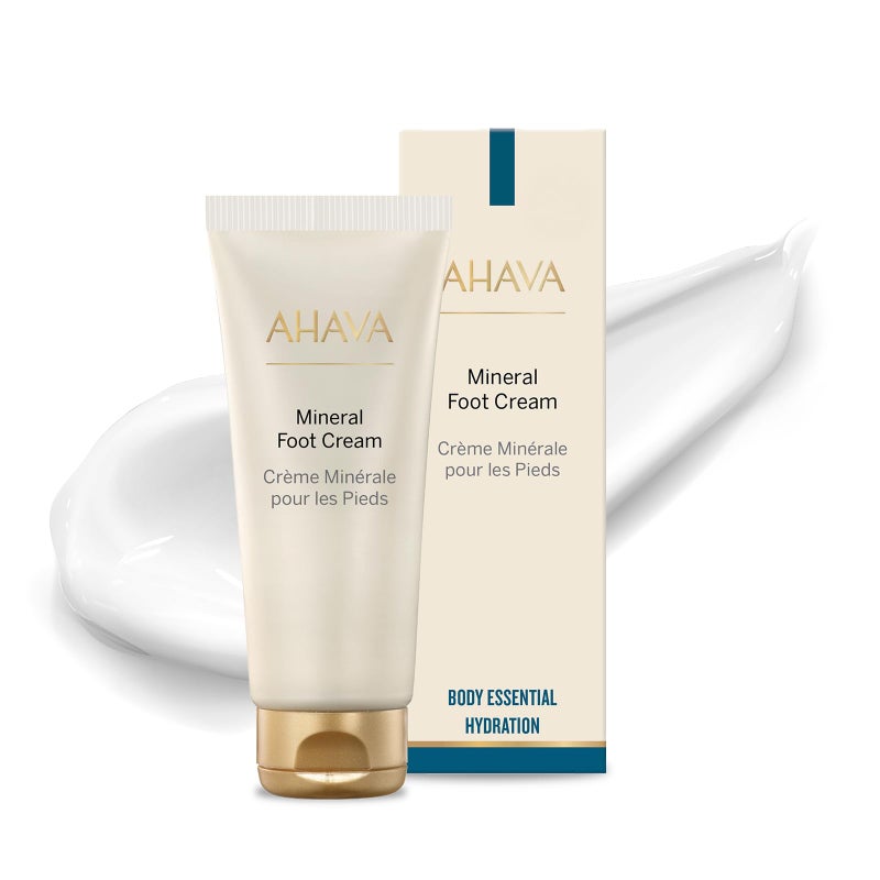 AHAVA كريم القدمين المعدني من مياه البحر الميت AHAVA - يغذي ويرطب باطن القدمين الجاف، يمنع التشققات والتهيج، مع أوراق هازيل الساحرة، مزيج أوسموتير، جوجوبا، أفوكادو، لوز حلو وزيت جنين القمح، 5.1 أونصة سائلة - Image 1