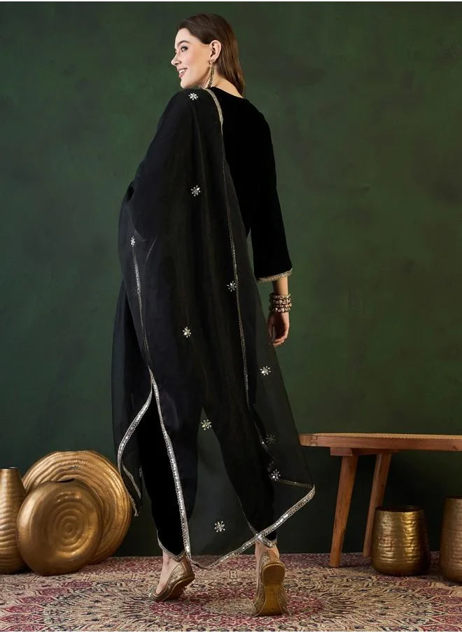 ISHIN Festive Women Black Velvet Kurta Set with Embroidered pattern Tunic and Palazzo features a Round neckline and Three-Fourth Sleeve secured with Elastic closure and styled in Straight Fit ideal for Festive moments — exude elegance in every glance.