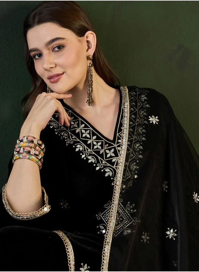ISHIN Festive Women Black Velvet Kurta Set with Embroidered pattern Tunic and Palazzo features a Round neckline and Three-Fourth Sleeve secured with Elastic closure and styled in Straight Fit ideal for Festive moments — exude elegance in every glance.