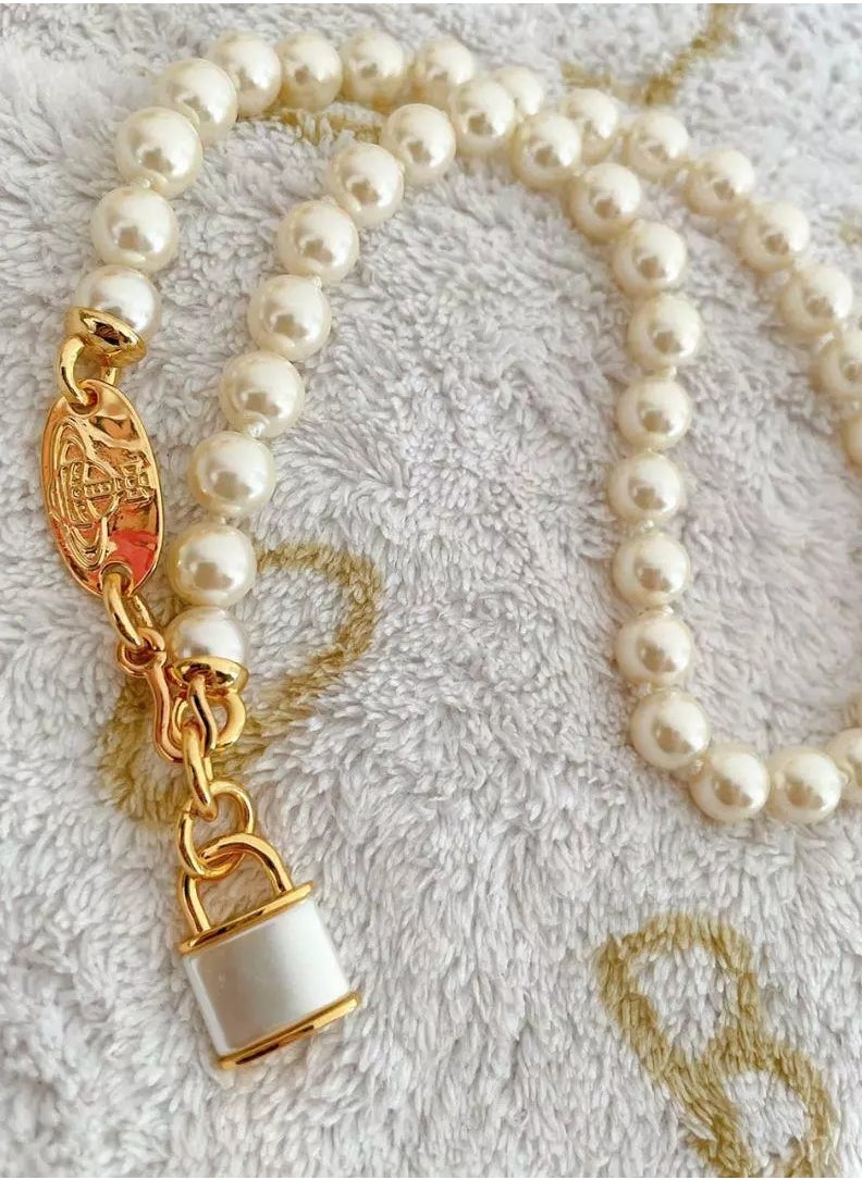 Vivienne Westwood - Key Lock Padlock Pearl Pendant Necklace-Gold - Image 1