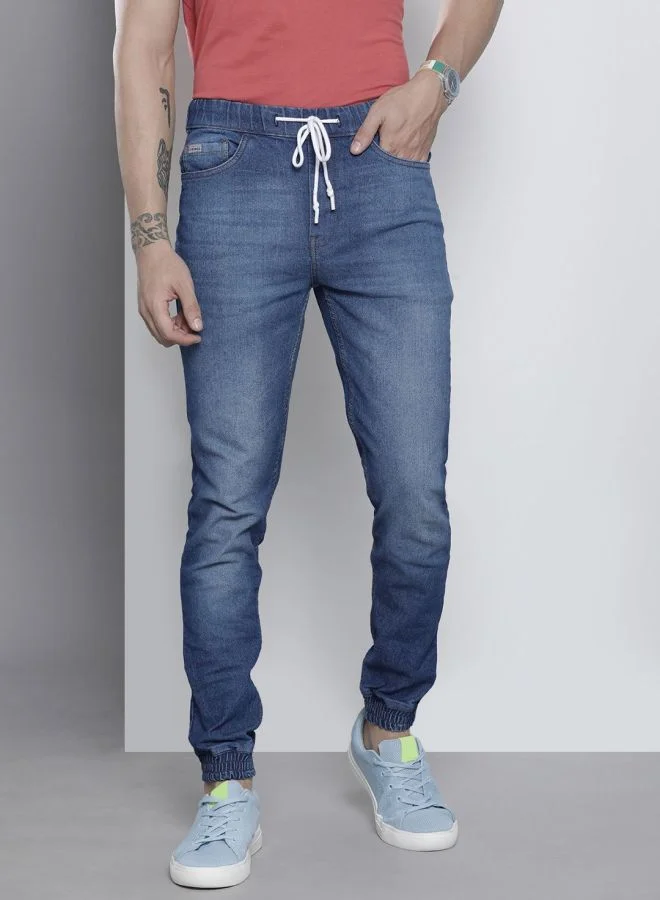 شركة المرآب الهندية Men Slim Fit Solid Mid-Rise Stretchable Denim Joggers