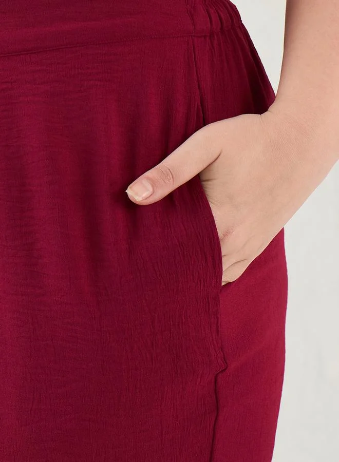 فيميلا طقم منسق بمقاس كبير من بنطال وبلوزة تونيك بتفاصيل مُجمعة