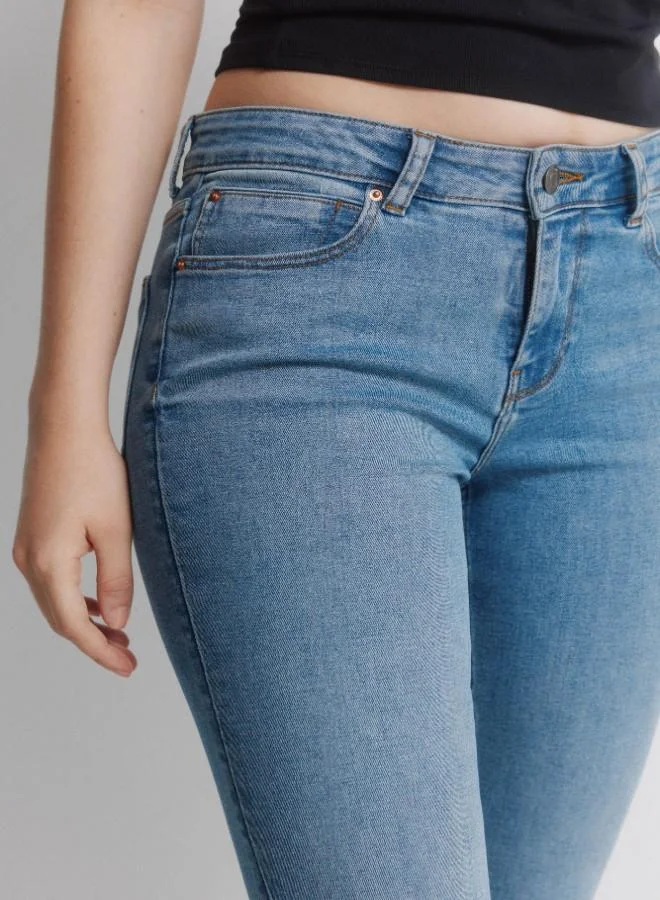 Springfield  Mid-rise fitted leg flared hem jeans for Women | Best Price UAE