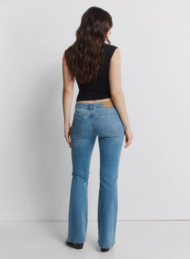 Springfield  Mid-rise fitted leg flared hem jeans for Women | Best Price UAE