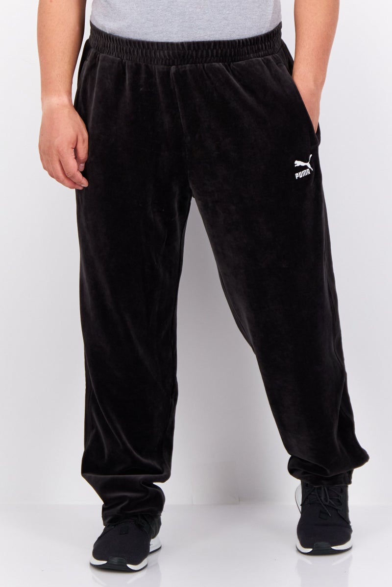 PUMA Men Sportswear Fit Embroidered Logo Outdoor Track Pant, Black - Image 1