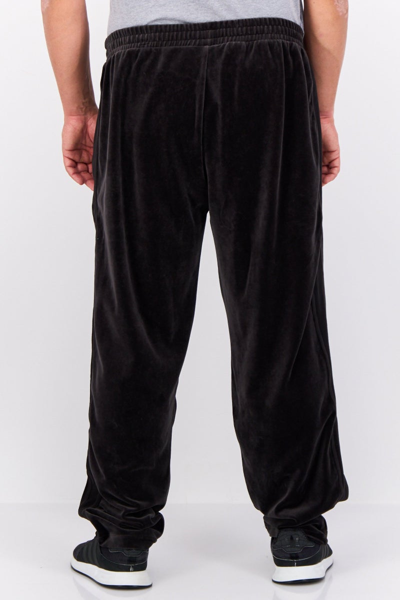 PUMA Men Sportswear Fit Embroidered Logo Outdoor Track Pant, Black - Image 3