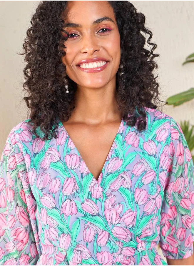 SASSAFRAS Tulip Print Wrap Peplum Top by Styli
