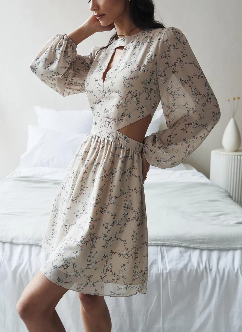 Lichi Mini dress from flowing fabric with waist and collar cutouts