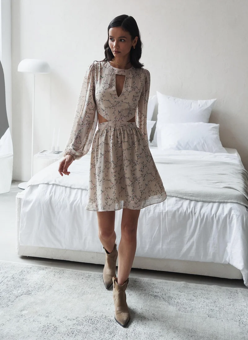 Lichi Mini dress from flowing fabric with waist and collar cutouts