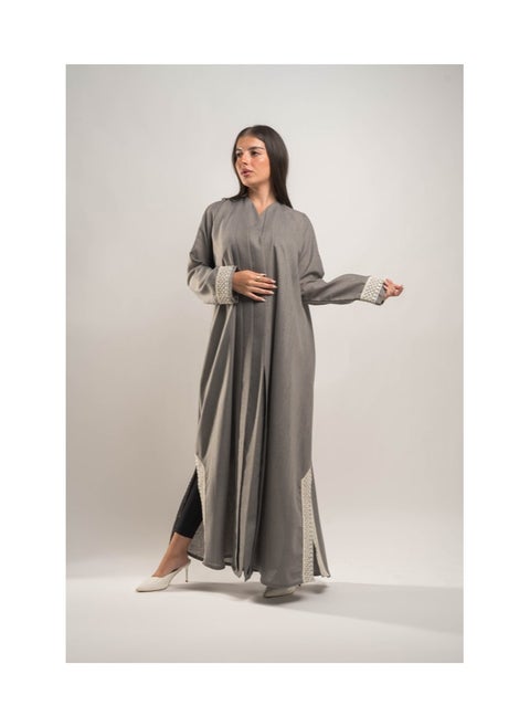 Luxurious linen abaya with a layered design on the front, embroidered inserts on the sleeves and two 14-inch openings on the sides of the abaya.