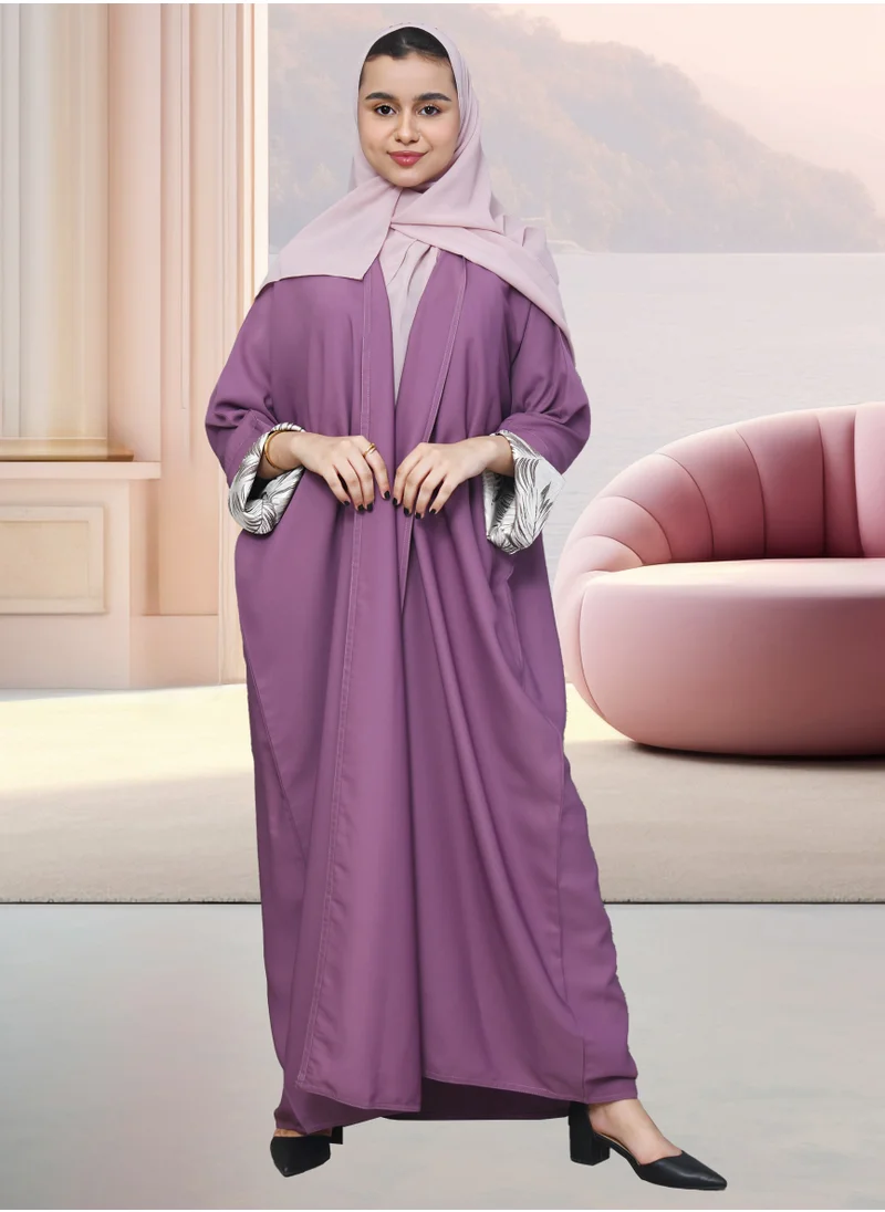 HAWRAA ABAYA Girls' quarter-bisht abaya in purple with open sleeves and lined with floral jacquard fabric