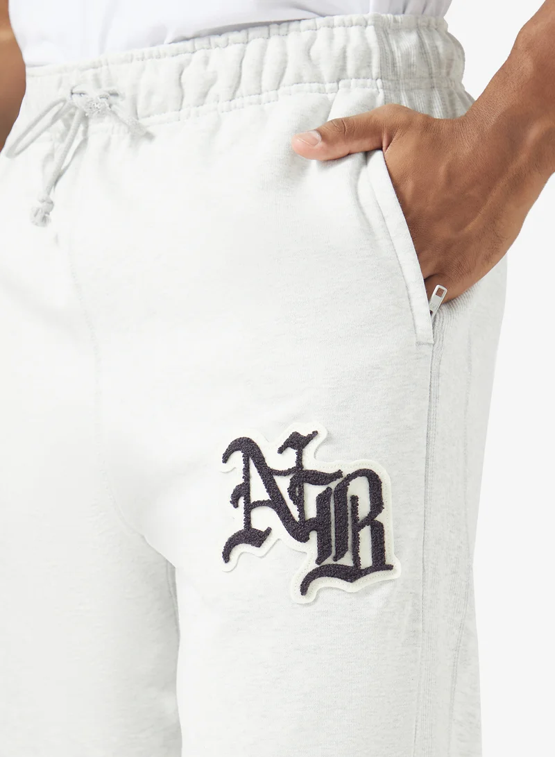 New Balance ASH HEATHER (AHH) Varsity Old English Sweatpants for Men | Best Price UAE
