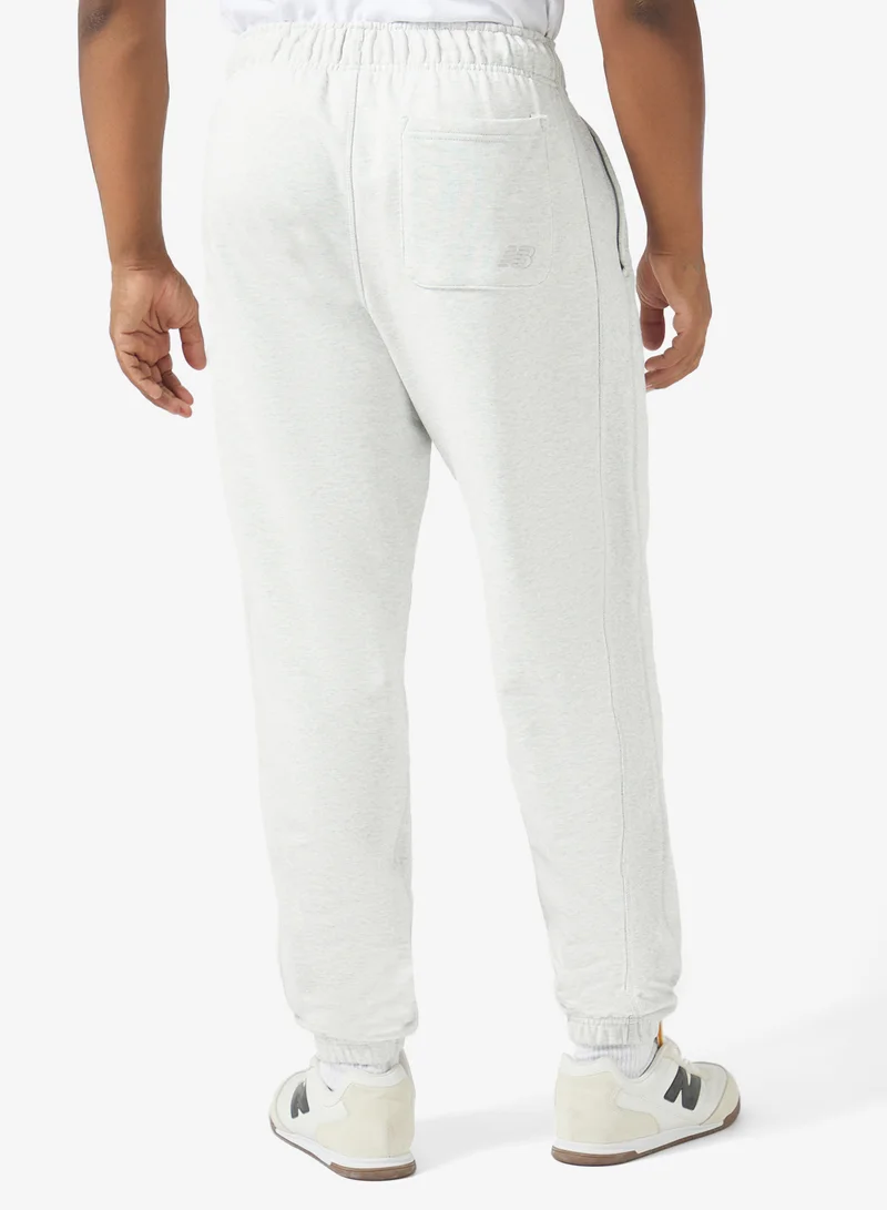 New Balance ASH HEATHER (AHH) Varsity Old English Sweatpants for Men | Best Price UAE