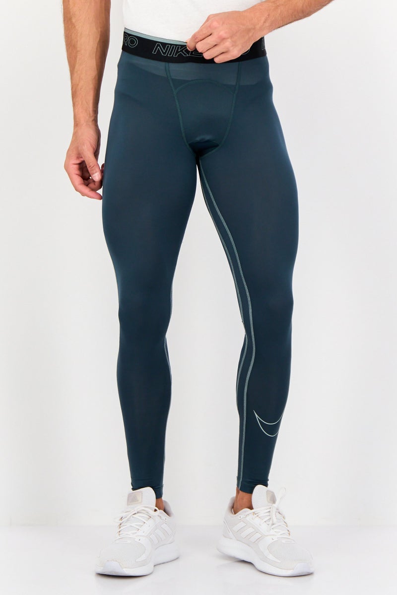 Nike سروال تدريب ضيق للرجال بشعار العلامة التجارية، أخضر داكن - Image 1