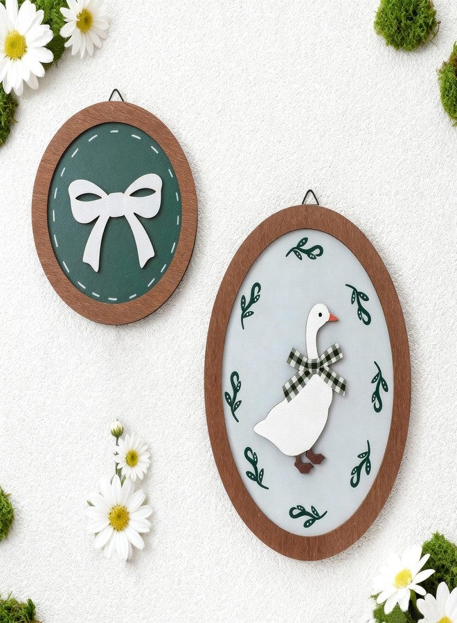 AceOrbit 2 Pcs Goose Nursery Decor, Wood Vintage Silly Goose Wall Art, Funny Duck with Green Bow, Cute Duck Decor, Wooden Round Framed Wall Hanging Decoration for Nursery Baby Room Playroom Bedroom - Image 1