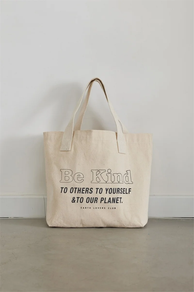 سود كوليكشن Saud Collection Ecru Be Kind Printed Canvas Bag