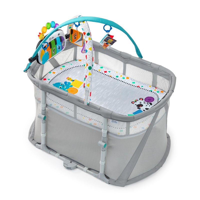 Baby Einstein Baby Einstein Kick Snooze 3in1 Foldable Playard Bassinet and Musical Play Gym Includes Fitted Sheet 3Step Easy Fold Piano Toy with 25 Minutes of Music Grows with Baby Ages 0 Months and Up