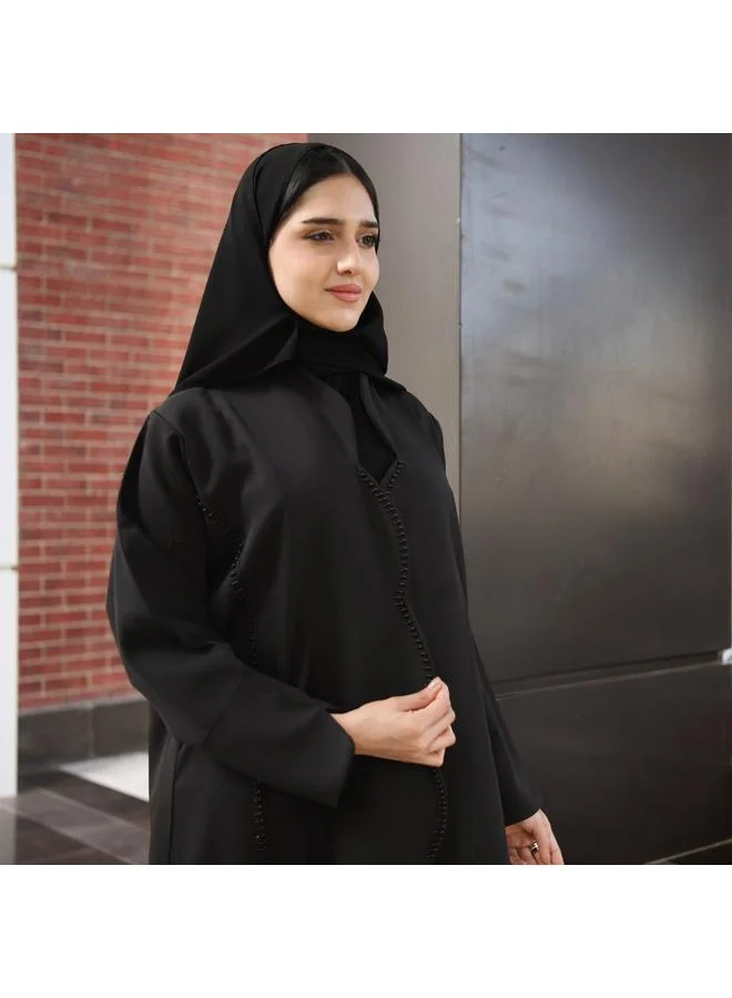 عبايات حوراء عباية سوداء بقصة مميزة من الامام مزينة بشك