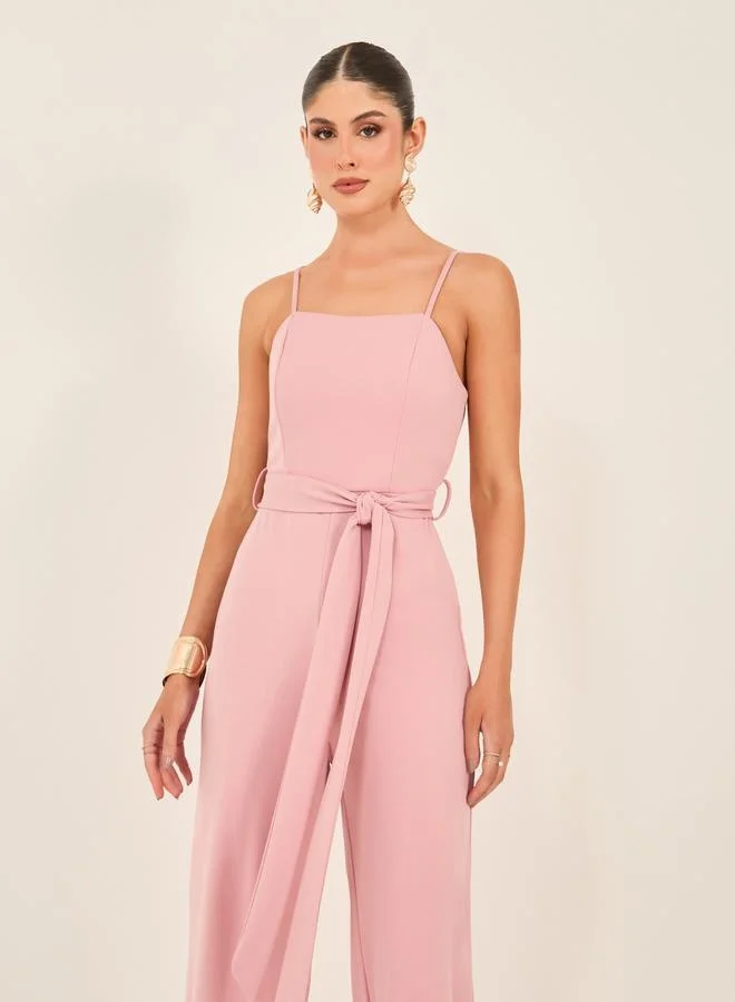 Styli Solid Strappy Wide Leg Jumpsuit with Waist Tie-Up Detail