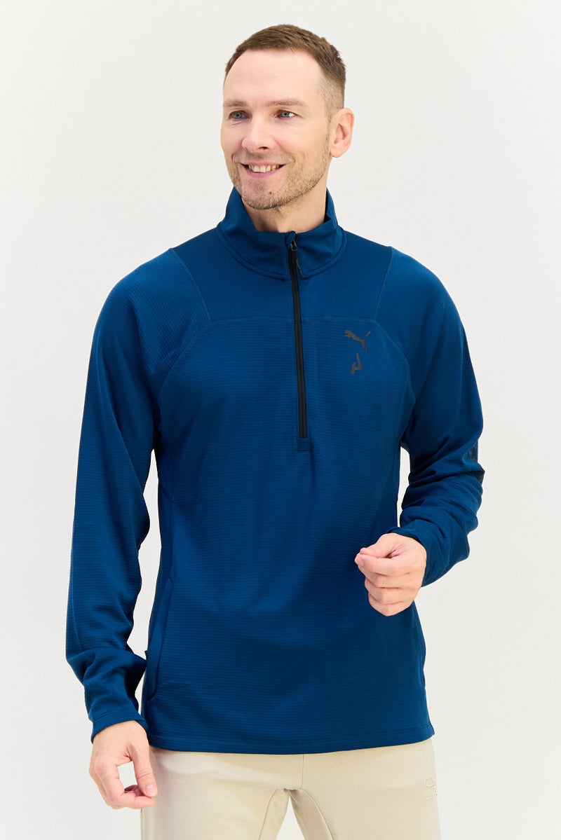 PUMA قميص بولو خارجي بأكمام طويلة للرجال، لون أزرق مائل إلى الأخضر، بشعار العلامة التجارية - Image 1