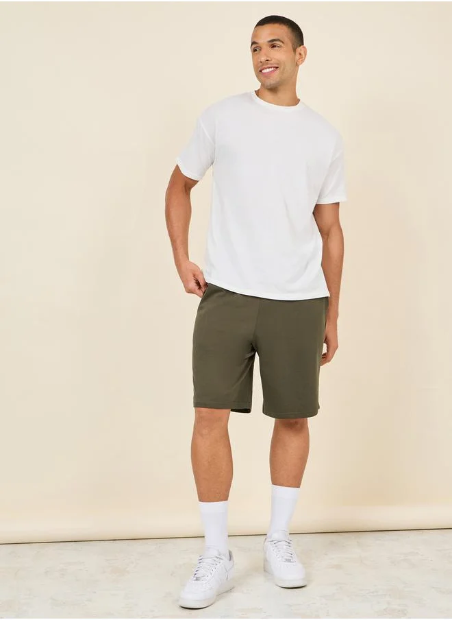 ستايلي Oversized Solid Shorts with Drawstring Waistband