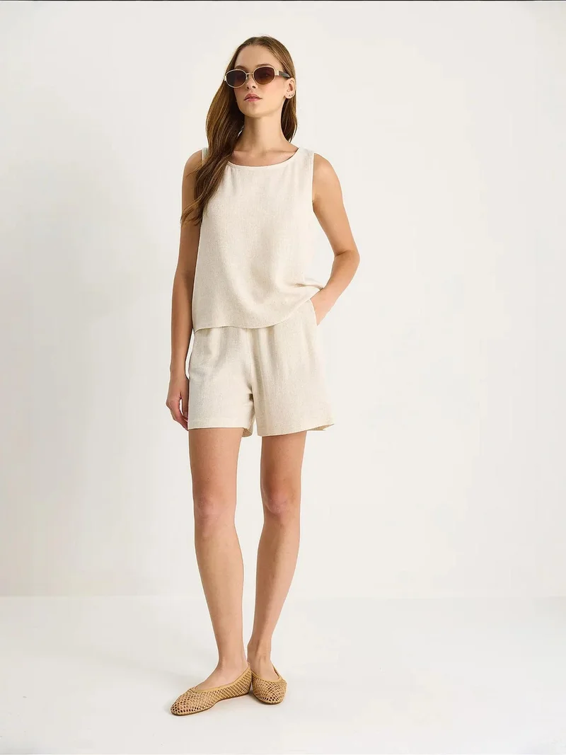 بيانكو لوتشي طقم نسائي واسع الساق من الكتان عالي الخصر من لوكسي