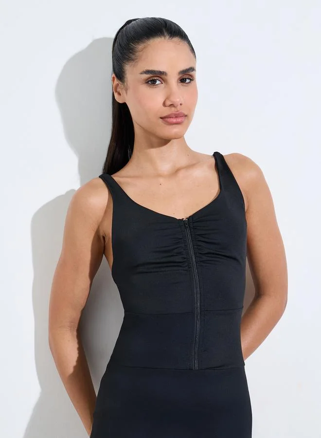 Styli Active  Black Solid Zip-Up Low Back Strappy Active Unitard for Women | Best Price UAE