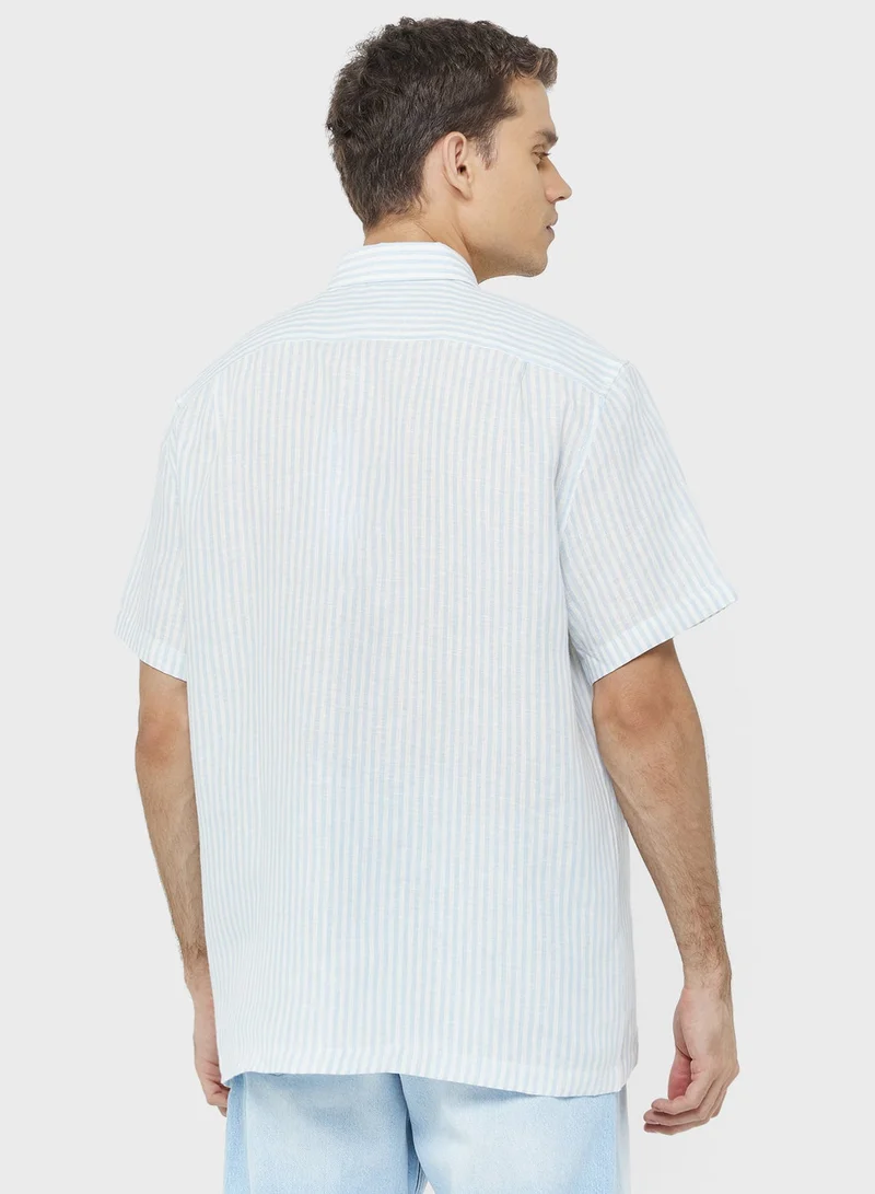 لاكوست قميص كتان مخطط بقصة عادية