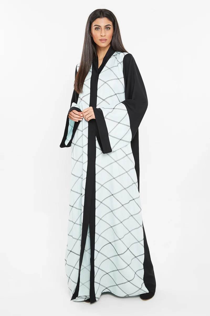 NUKHBAA A pastal blue abaya with square patterned embroidery detail.-AJ113A