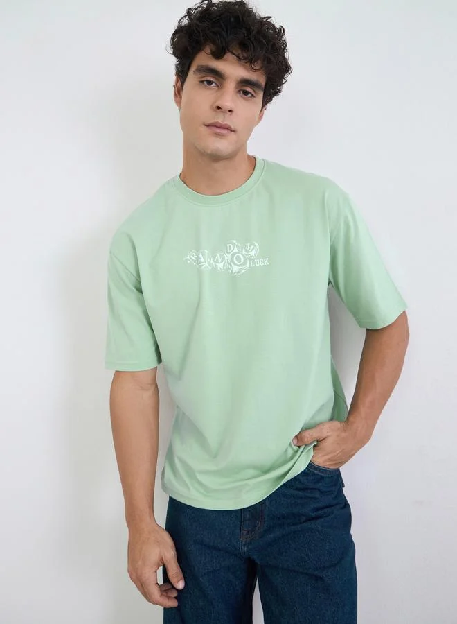 Styli Men Green Graphic Print Oversized Jersey T-Shirt