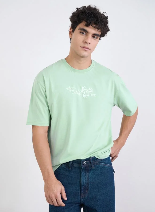 Styli Green Men Green Graphic Print Oversized Jersey T-Shirt for Men | Best Price UAE