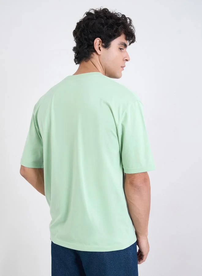 Styli Green Men Green Graphic Print Oversized Jersey T-Shirt for Men | Best Price UAE