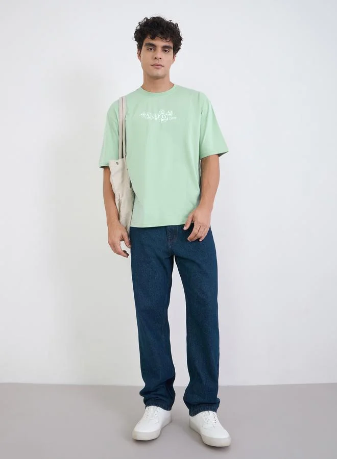 Styli Men Green Graphic Print Oversized Jersey T-Shirt