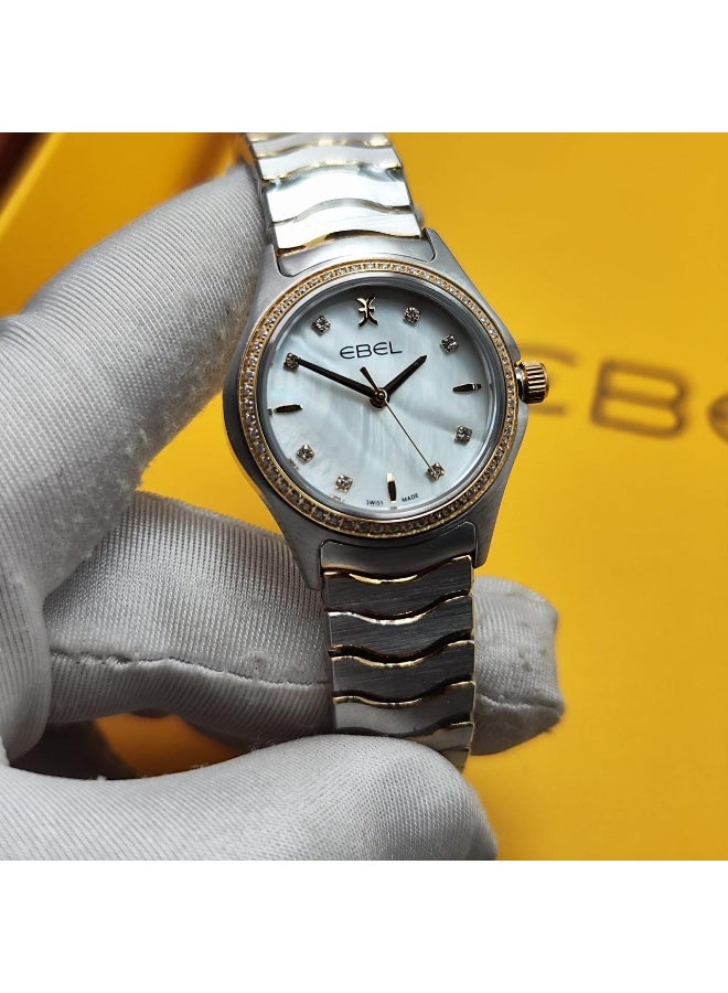 The Ebel women's watch features a classic design with a distinctive wave-shaped strap.