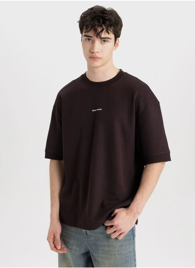 ديفاكتو Loose Fit Crew Neck Slogan T-Shirt