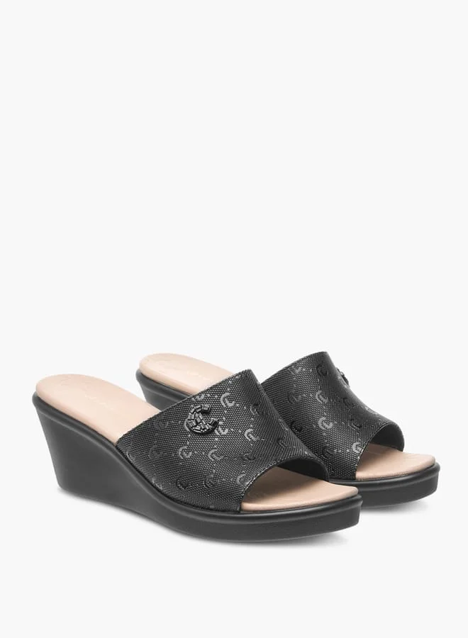 Le Confort Womens Monogram Embossed Sandals With Wedge Heels