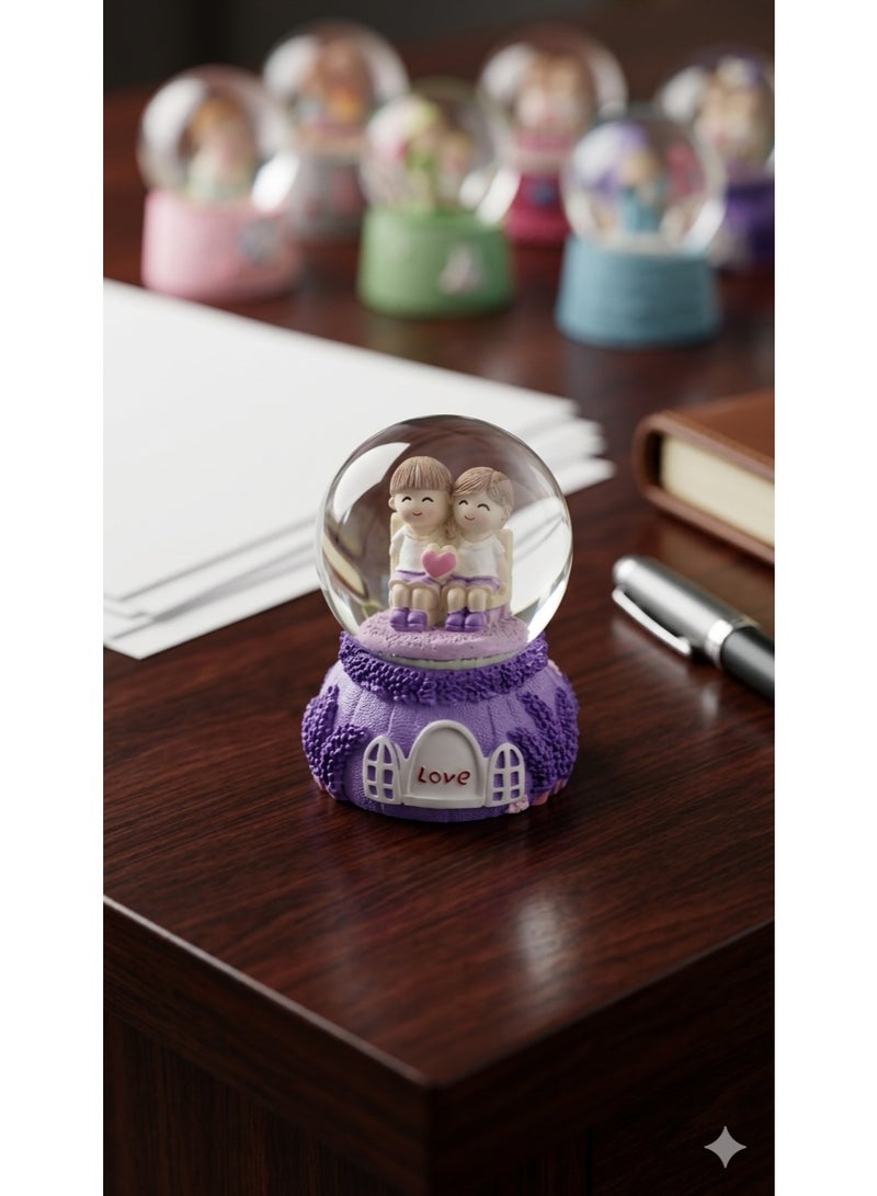 A luminous snow globe glass crystal with a "love" design, cartoon characters, and a decorative purple base - a perfect gift for any occasion.