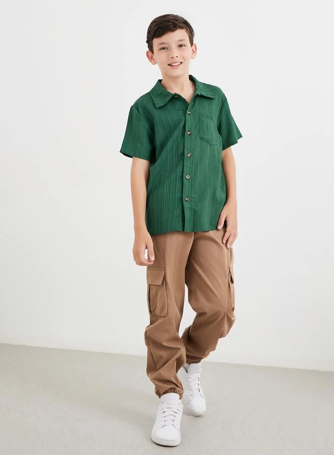 ستايلي قميص بتفاصيل بارزة الملمس مع أزرار